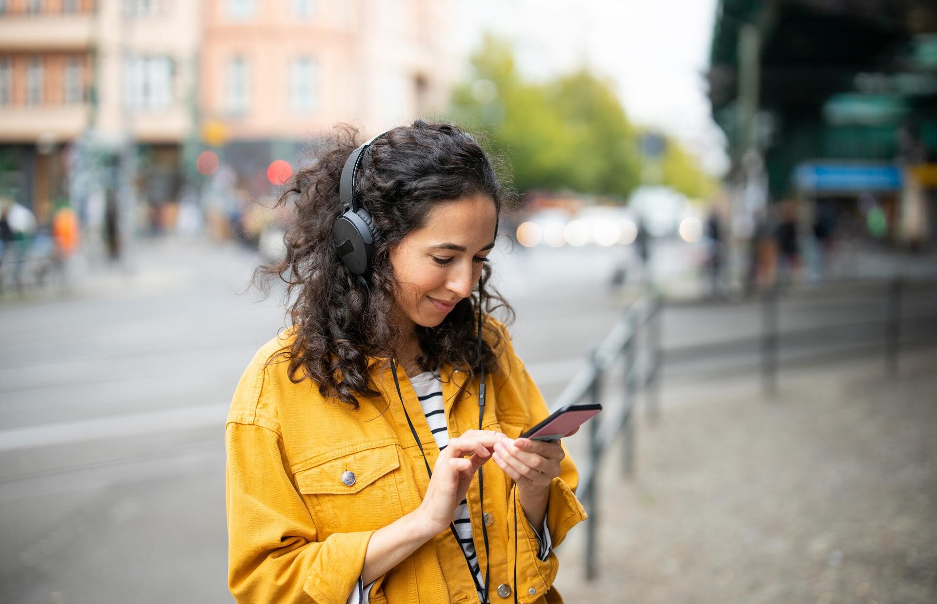 Woman-listening-music-from-her-smart-phone